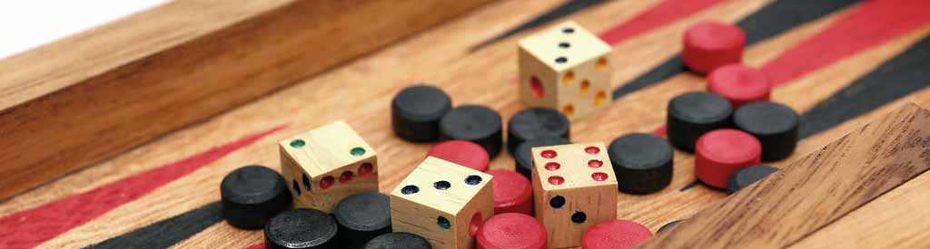 Backgammon is played with dice on a board.