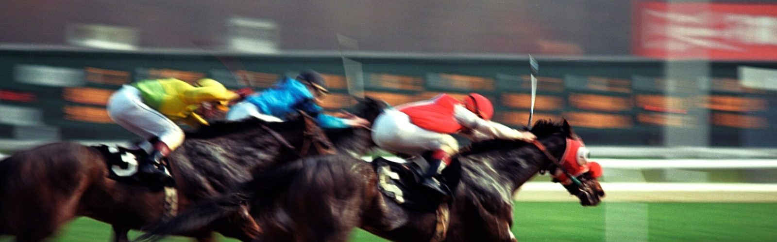 The finish of a horse race: the moment a win bet and a place bet are decided.